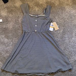 Cutest stripped dress. Very flattering. Never worn